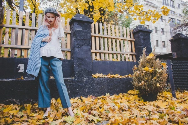 woman street style outfit neutral tones boots urban fashion 2025